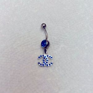 Double “C” belly ring with blue rhinestones